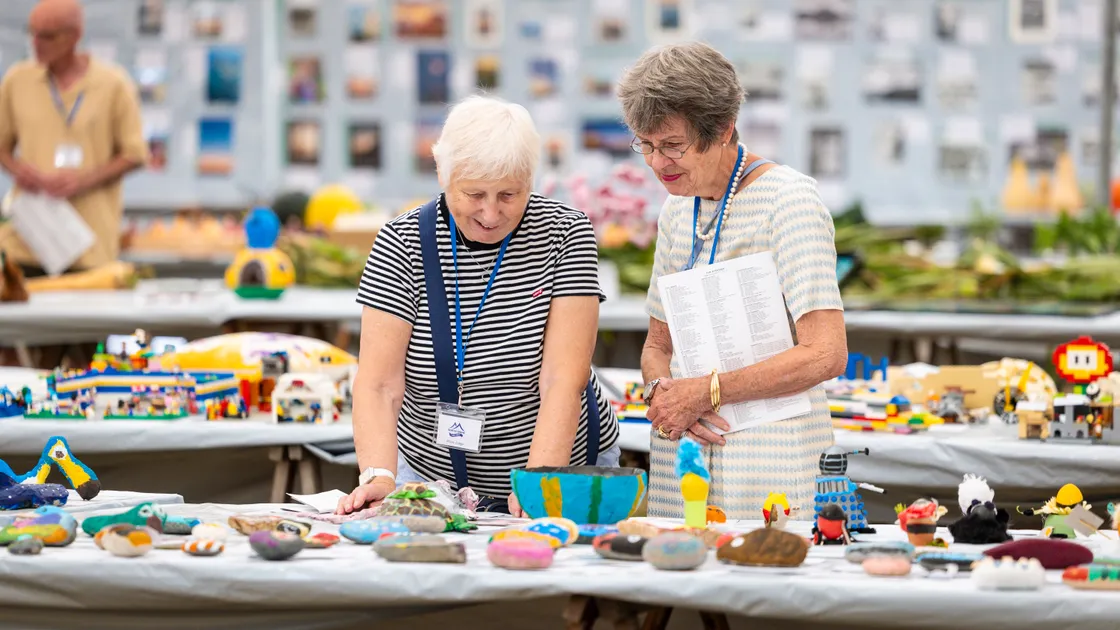 Ann Graham and Anne Bott judging the children’s crafts.