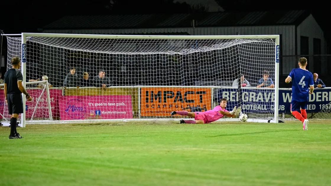 St Martin’s goalkeeper Max Wall makes one of his three saves during their penalty shoot-out win over Indies on Monday night at the Track.