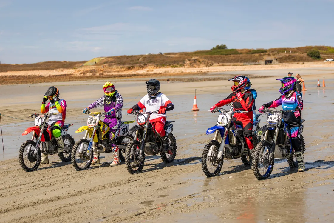 The MX riders line up at the start of a race.