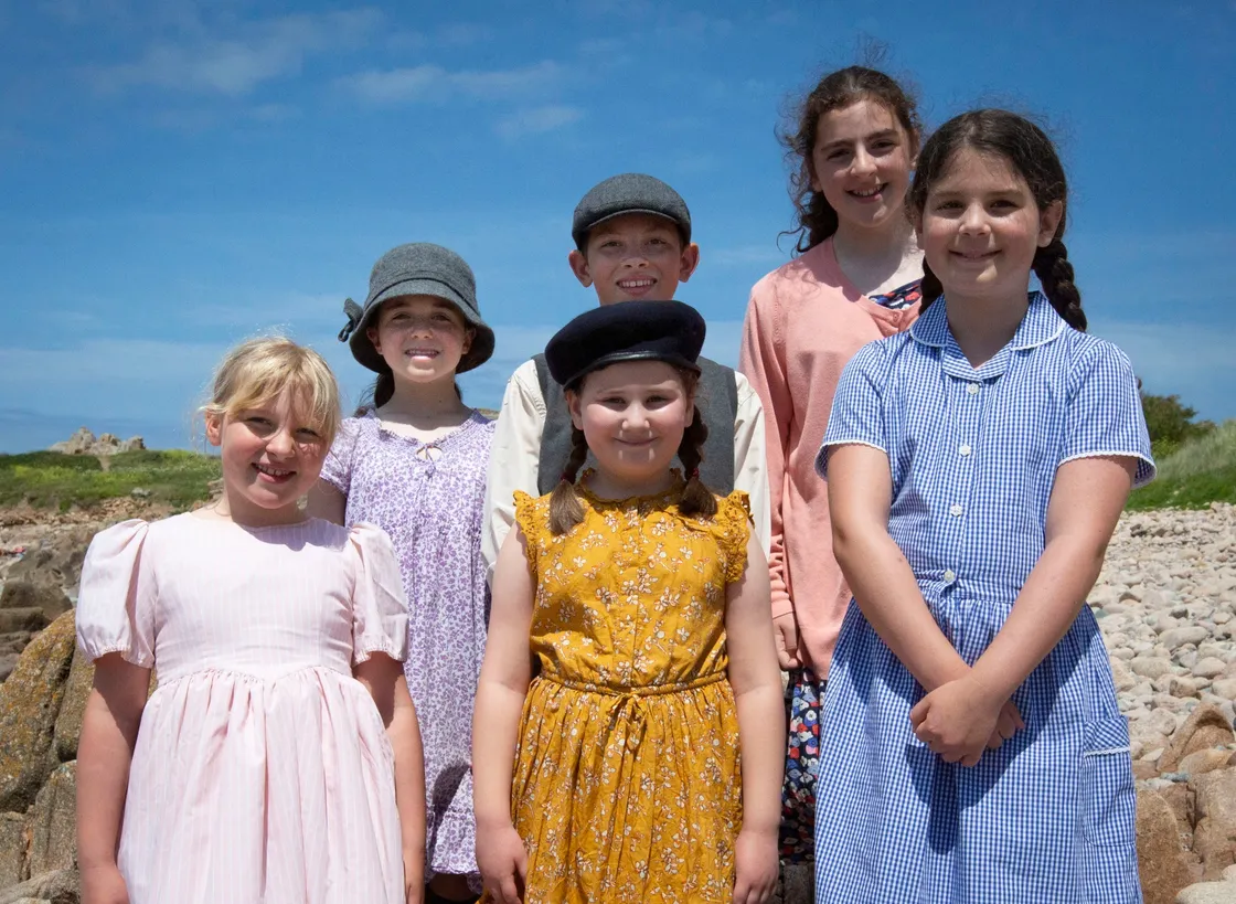 Left to right, Ines (11), Wills (11), Kelynn (11),  Alizah (8), Jenny (7), Evie (10). Filming at Les Grandes Rocques with La Mare De Carteret primary school for the A La Perchoine musical. (Picture by Cassidy Jones, 29633171)
