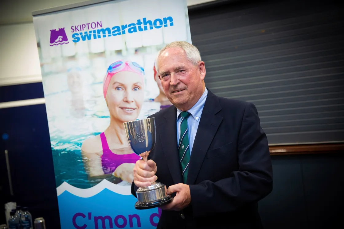 Nick Guillemette, who is stepping down as chairman of the organising committee, received a special cup for his outstanding contribution to the Swimarathon.(30086837)