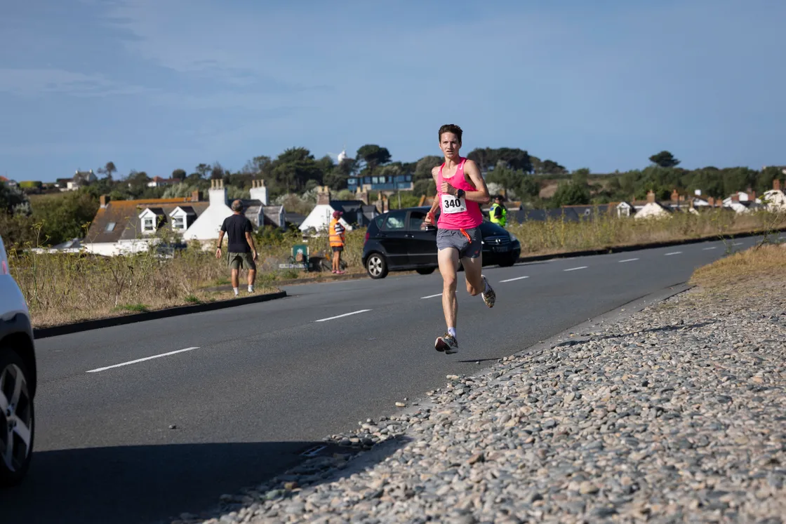 Jack Rees on the stretch of coast road where he had broken the Vazon Mile record three days earlier, on his way to victory in the Guernsey Mind 10k.