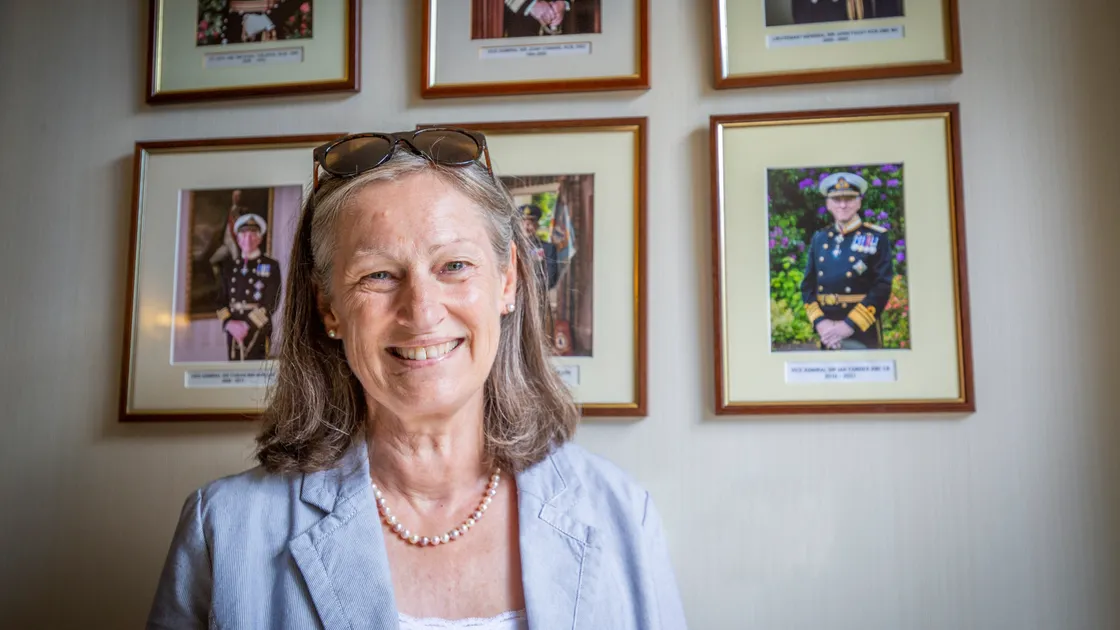 Tina Pipet, who has been made a Member of the Royal Victoria Order, the personal gift of the Queen, in recognition of her service at Government House. She is standing in front of the portraits of the four Lt-Governors she served as personal assistant. (Picture by Sophie Rabey, 30884694)