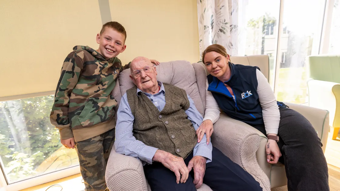 Liberation Day hampers, sponsored by Rok Construction, were delivered to care homes around the island yesterday. At Blanchelande Nursing Home, Tom Morris, 102, is pictured with his family Jacob Alderton, 9, and Philippa Hardwick.				 (Picture by Sophie Rabey, 34744498)