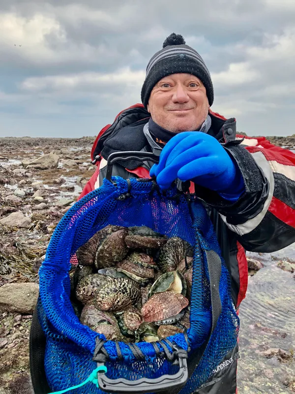 Colin Merrien found more than 50 ormers in little over 90 minutes at Perelle yesterday on the first tide of 2024. (Picture by Andy Brown, 32872433)