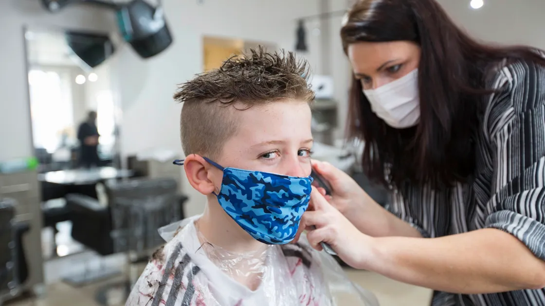 A slightly apprehensive look from Jacob Morgan as Elaine returns him to his spiky hairstyle of three years ago. (29331636)