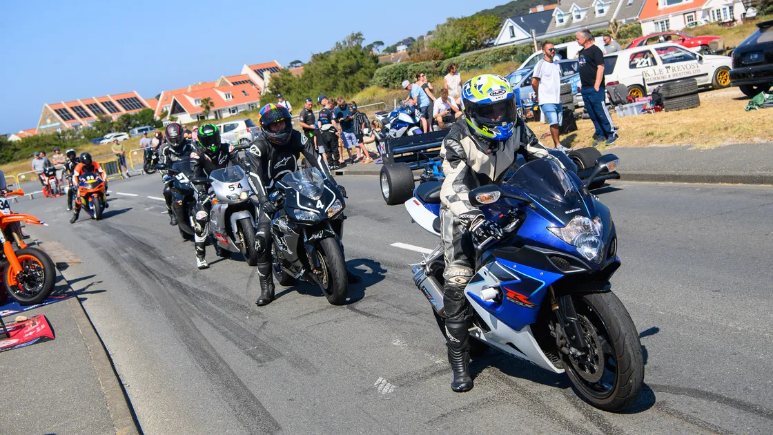 Motorcyclists line up for their next run at Vazon.