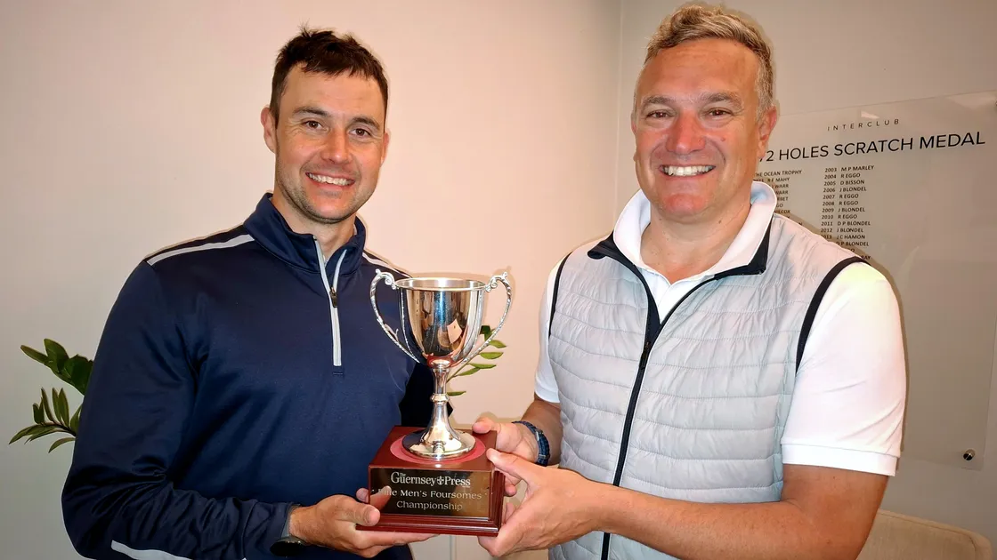 Jack Mitchell and Danny Bisson with the Guernsey Press Elite Men’s Foursomes Championship trophy.