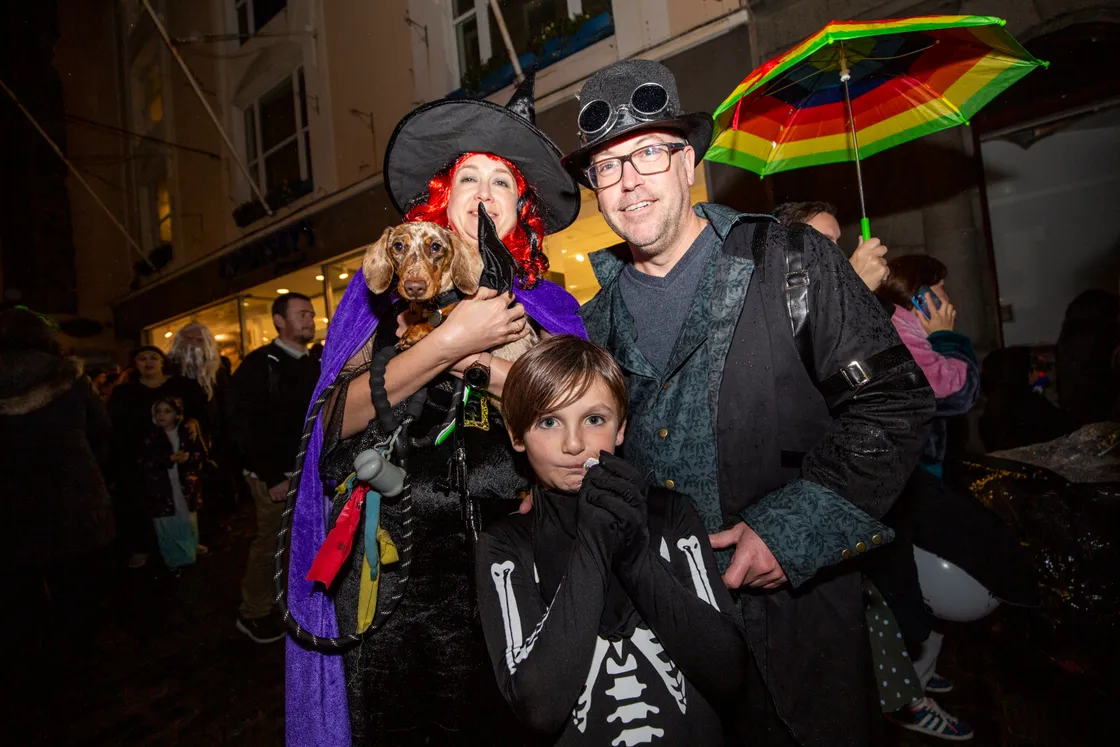 Eight-year-old Tommy Creber chose his own skeleton costume. He is with Emily Robinson, dog Dunlop, and Chris Creber. (31429277)