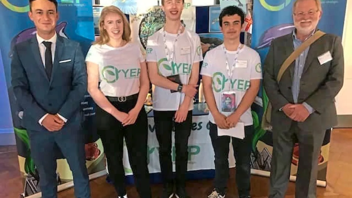 Guernsey Young Enterprise area board member, Adam Langlois, with YEP Guernsey's, Lizzie Kennedy, Jack Cummins and Jacob Brady at their stall for the finals in London. (24993213)