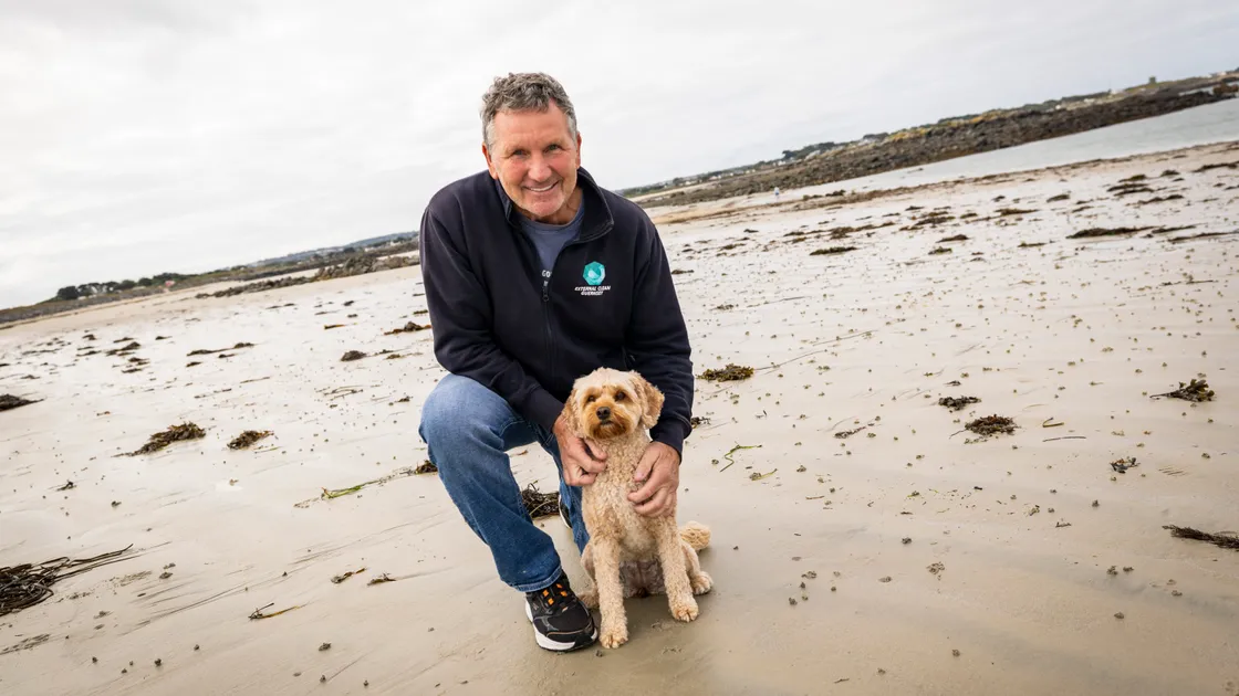 Steve Snell with his dog, Biscuit, on Chouet Beach. He is calling for there to be discussions about possibly changing how dogs are limited from some beaches for part of the year. 							 (Picture by Sophie Rabey, 34414077)