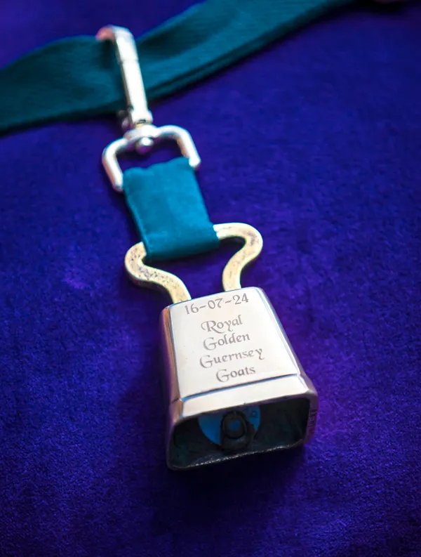 Tamsin the goat, representing the Golden Guernsey breed, was presented with the Royal title and this golden bell. (33423719)