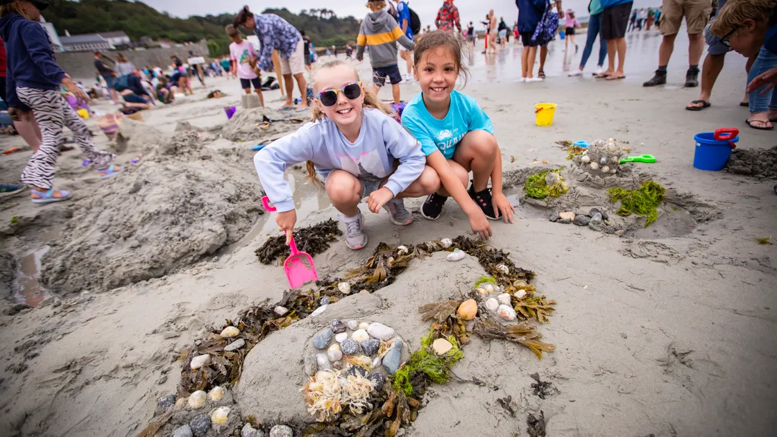 Amelie Falla, 8, left, and Eloise Rodrigues, 9, with their puffin sandcastle sculpture at Saturday’s Rocquaine Regatta. (Pictures by Sophie Rabey, 32349309)