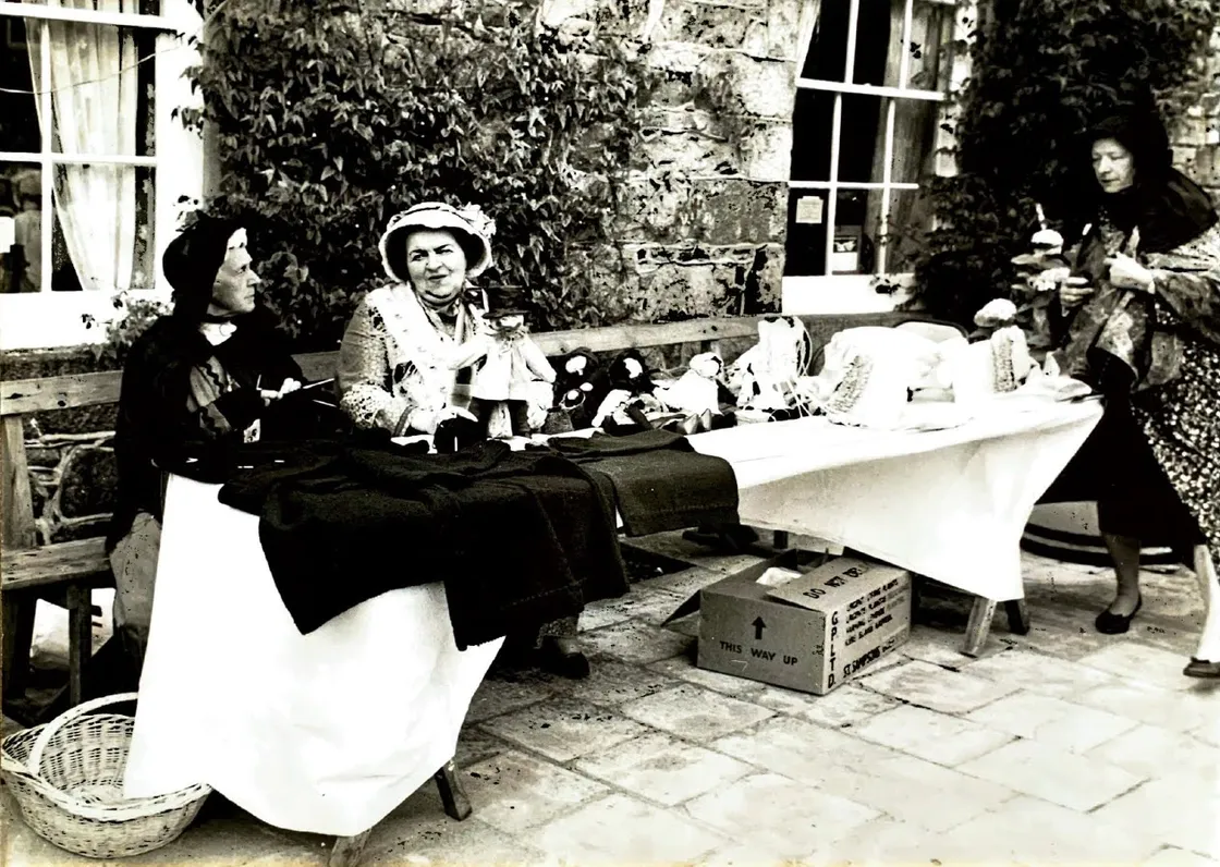 Anyone for Dolls? In The Folk Museum courtyard volunteers display some traditional Cobo Alice dolls