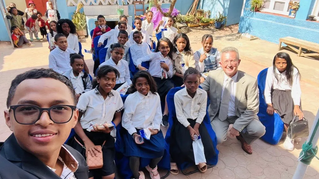 Guernsey expat and former Bourse CEO Paul Cutter with schoolchildren in Antananarivo. Right, officials at a ceremony to mark the refurbishment.	 (Pictures supplied)