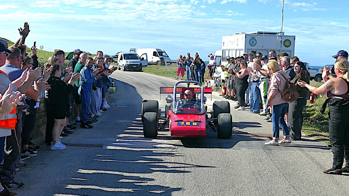 Peter Clarke, 79, receives a standing ovation as he returns to the Fort Tourgis pits having completed his final run.