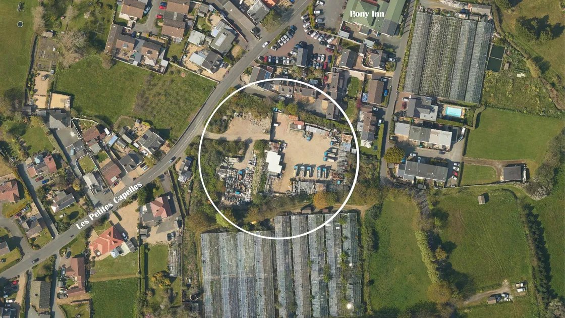 The site off Petites Capelles Road, which is partly leased to a scaffolding firm. The land’s UK-based owner has been refused permission to extend the yard. (Image courtesy of Digimap, 30436439)