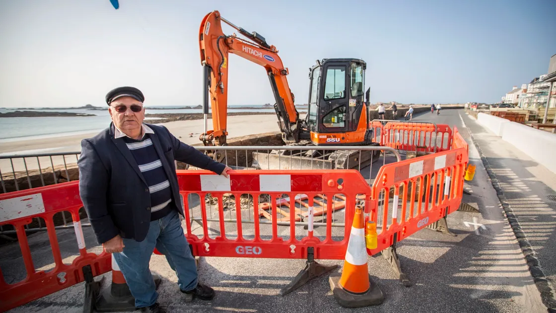 Deputy Barry Paint, who has lived in the area for nearly 30 years, knows something of the history of the building of the road at Cobo and has his theory as to why two holes have appeared in it. (Picture by Sophie Rabey, 28151889)