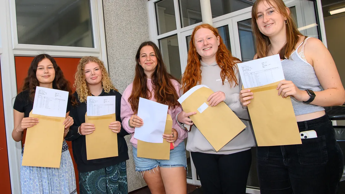Students from La Mare de Carteret High, left to right, Esmee Vidamour, Gisele Jones, Amelie May Jehan, Hollie Archenoul and Sian Craig, with their results yesterday