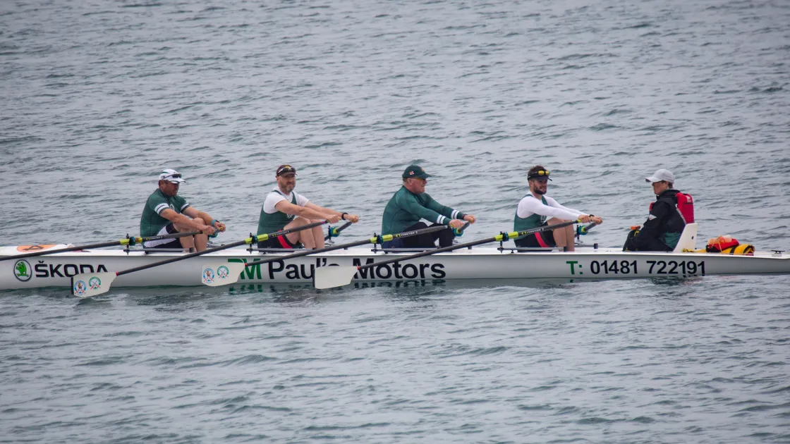Lt-Gov Richard Cripwell is in the centre of boat 84 in the Guernsey Rowing Club's 50th Anniversary Regatta race from St Peter Port to Chouet. (Picture by Sophie Rabey, 32199221)