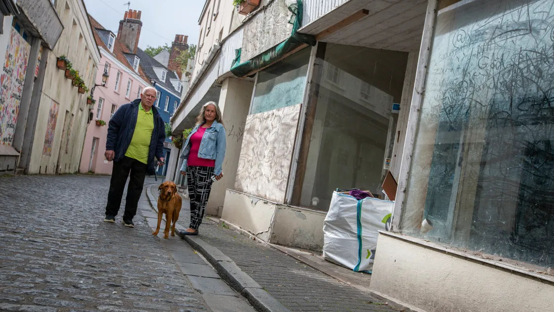 States are recommending penalising owners of derelict buildings with increased TRP as part of their budget proposals. St Peter Port douzenier Phil Smith (with his dog Mellow) and senior constable Zoe Lihou in Mansell Street. (Picture by Luke Le Prevost, 32607863)