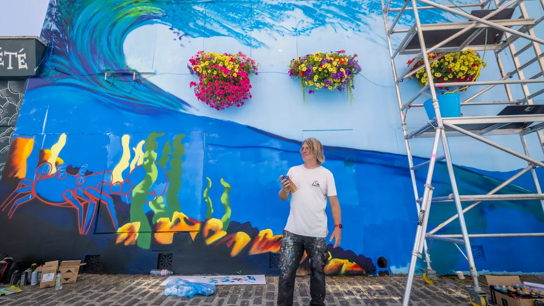 Artist Tim Gaudion in Mansell Street where Art for Guernsey’s Street Art festival was taking shape yesterday.