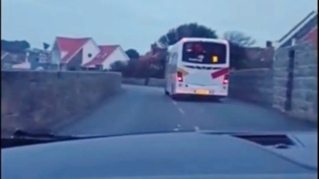 A video was posted on Facebook of this bus rounding the corner near Perelle garage and drifting onto the right-hand side of the road, moving out of the way just fractions of a second before a car pulled out from a lane on the right.