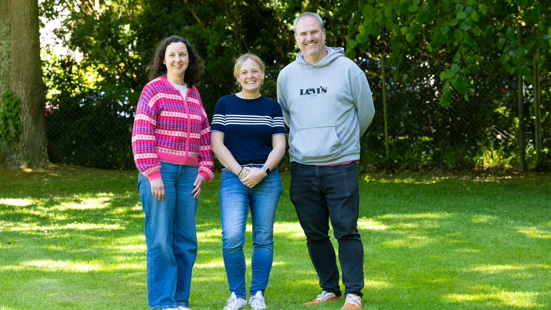 Senior supervising social worker Vicki Tennant, centre, with foster carers Ben and Cathy Martin.
