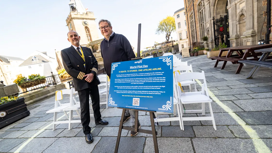 Pilot Captain Mike Read, left, and Aurigny's chief commercial officer Philip Saunders at Aurigny’s one-day visual installation in Market Square for World Pilot Day. 72 individual seats behind them each represent a real passenger journey from people travelling with Aurigny.			 	 (Picture by Sophie Rabey, 34723909)