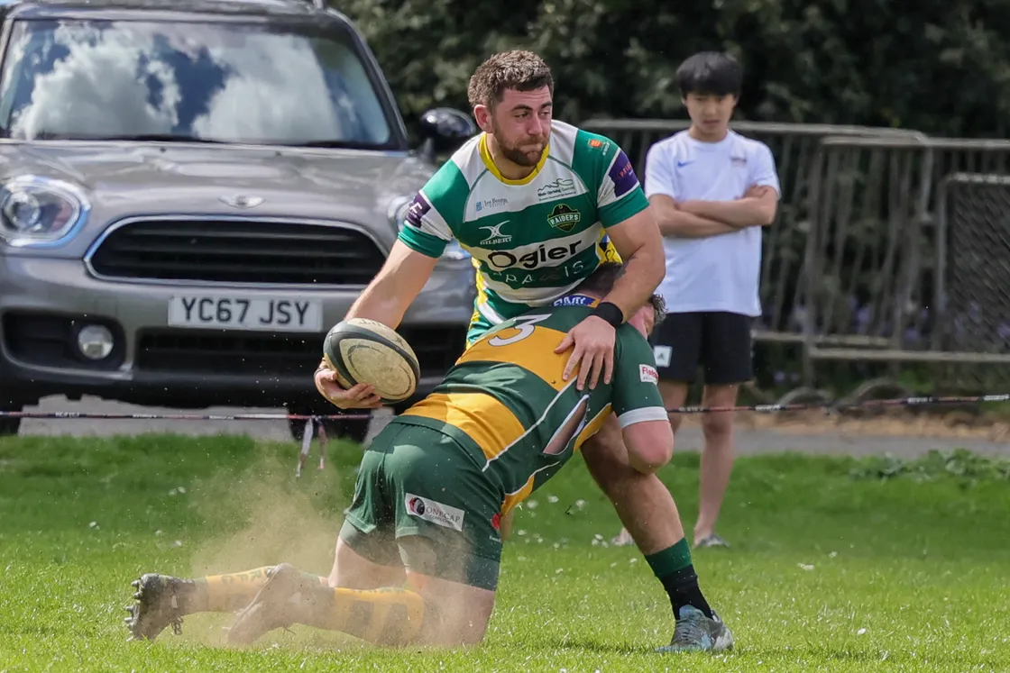 Brad Webb offloads out of a tackle.