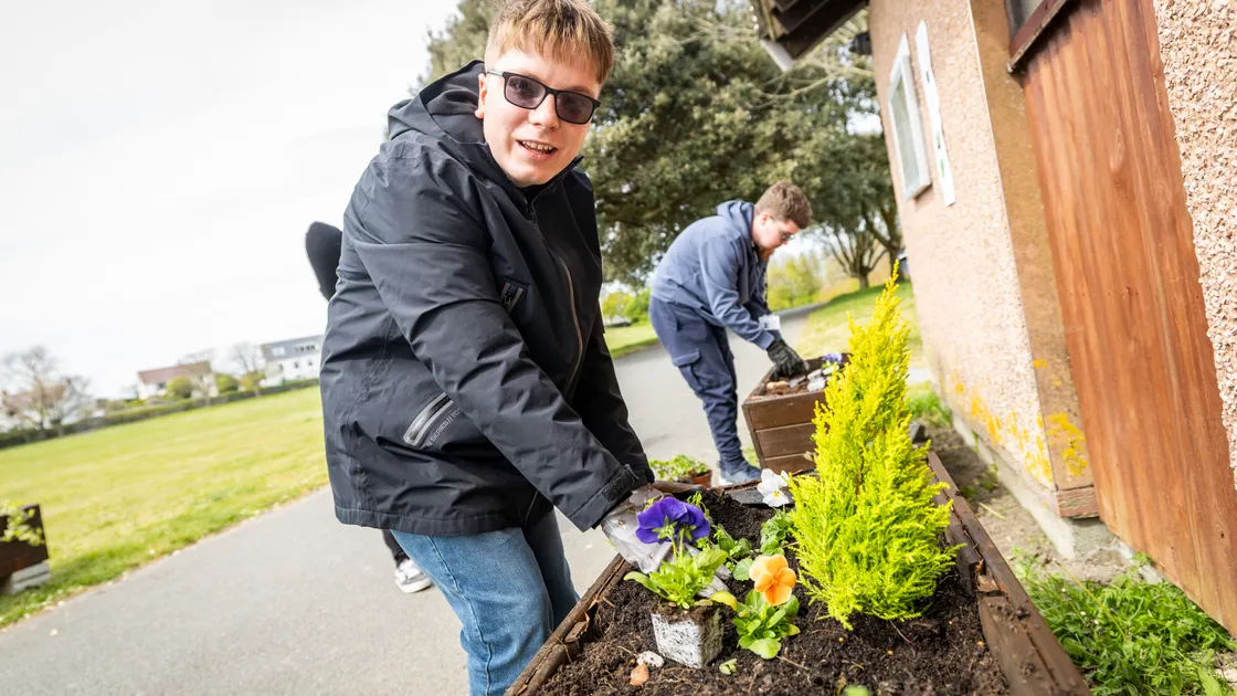 St Sampson’s Douzaine has been planting flowers at Delancey Park for its Floral Guernsey entry, with the help of supported traineeship students from TGI, such as Arnie Moriarty, 17.  (Picture by Sophie Rabey, 34717454)