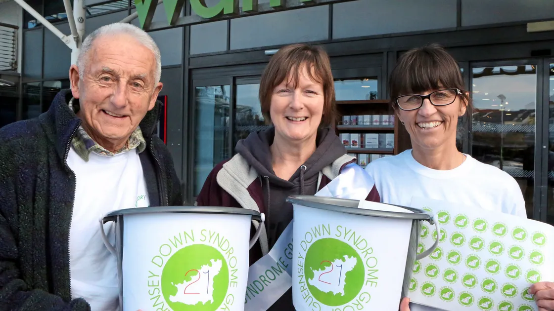 Selling flags outside Waitrose Admiral Park on World Down Syndrome Day were three members of the local group, Kevin Falla, chairman Kim Marquis and treasurer Helen O’Hara.                                                                                        (Picture by Steve Sarre, 20994283)