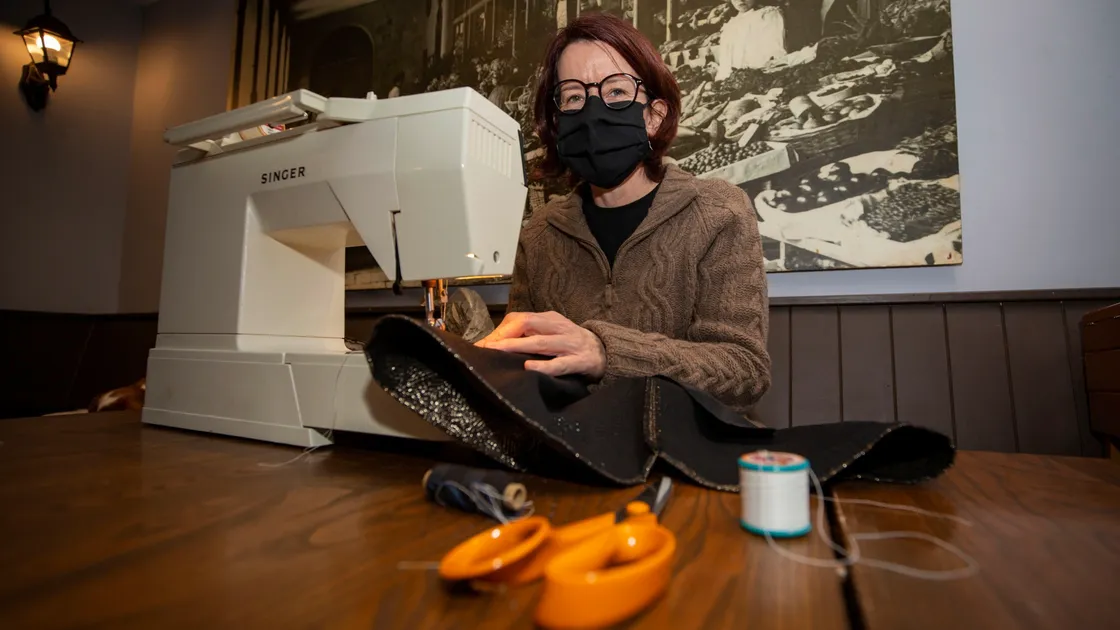 Seamstress Sarah Koulloutas repairing some clothing at the first repair cafe of the year held upstairs at The Golden Lion. (Picture by Sophie Rabey, 30372559)