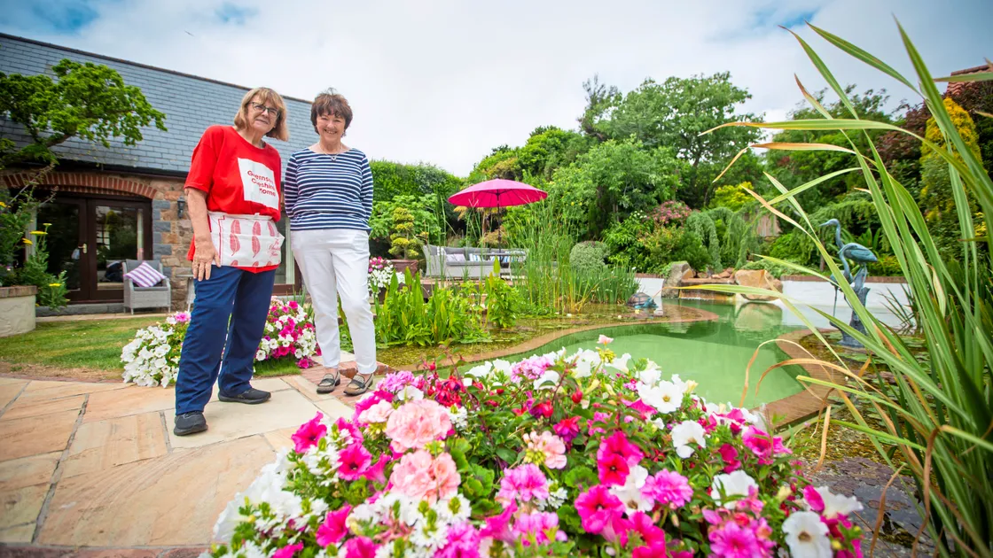 Guernsey Cheshire Home patron Cherry McMillan, left, and Les Villets Farm owner Susie Farnon at the open garden event raising money for the charity. (Picture by Peter Frankland, 33378042)