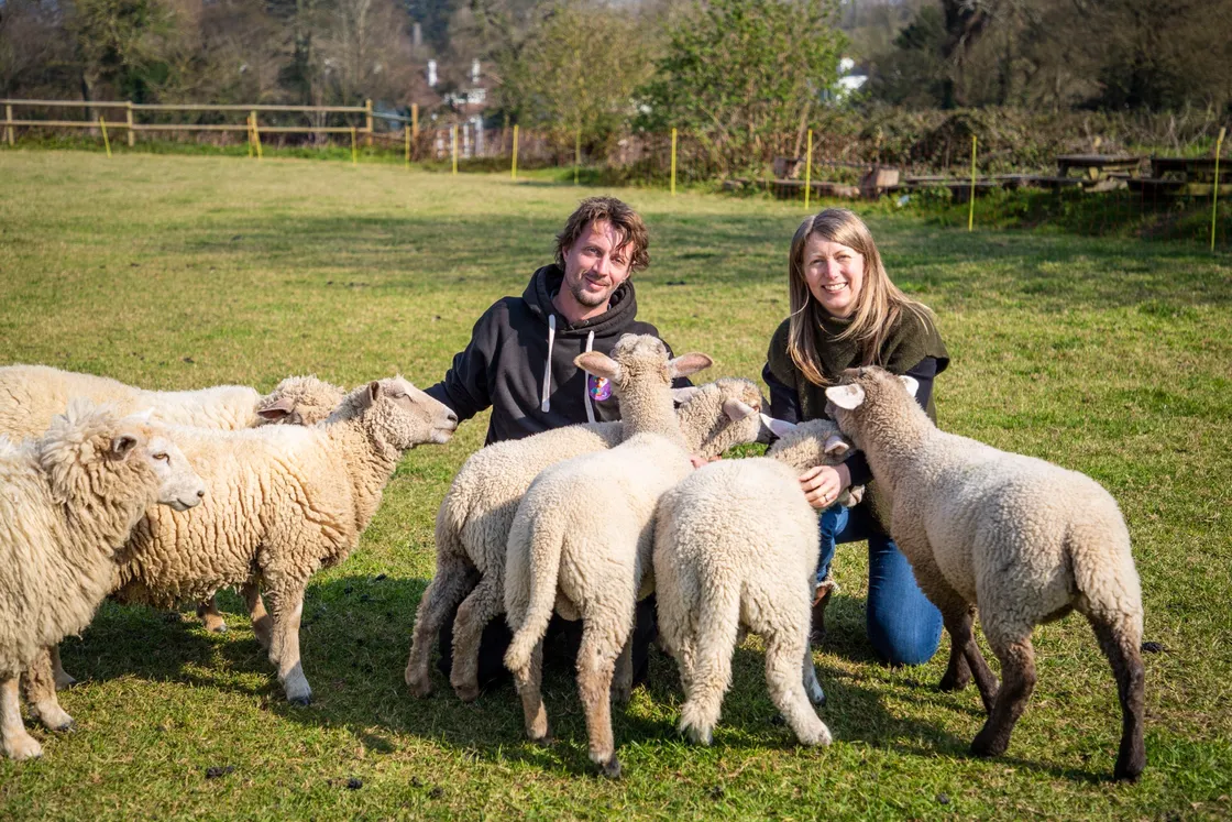 Ryan and Charlotte Le Guilcher with their new lambs. (27748499)