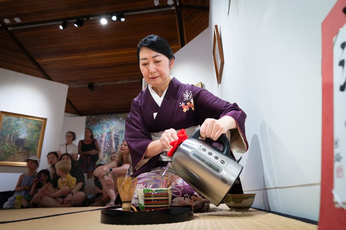 Mayuno pours the water from a non-traditional kettle