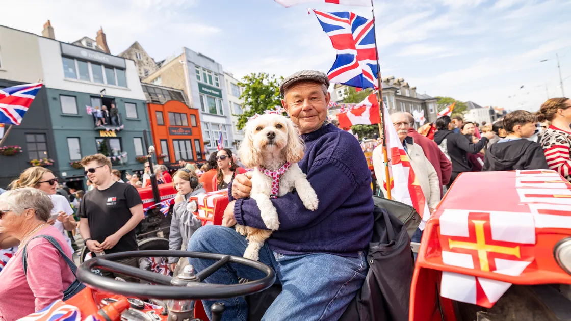 Mark Le Prevost on his 1968 Massey Ferguson with Bailey the dog on the cavalcade. (Pictures by Sophie Rabey, 34745350)