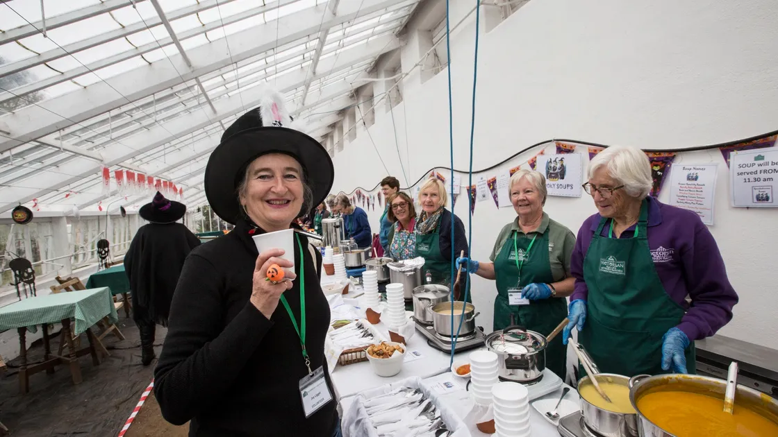 Volunteer Joy Liggett tries one of the soups. (28835386)