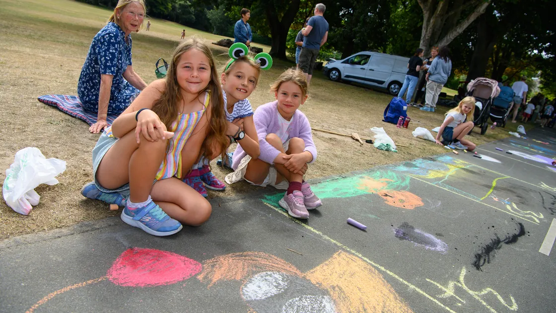 The de la Fosse family next their colourful drawings on the path at Saumarez Park. Left to right: Innez, 9, Alicia, 8, and Maria, 5