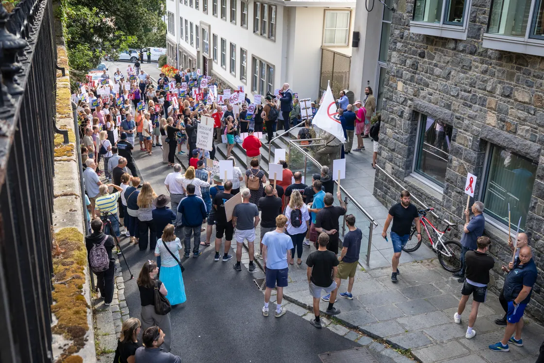 More than 200 islanders gathered outside the States ahead of the start of the meeting.