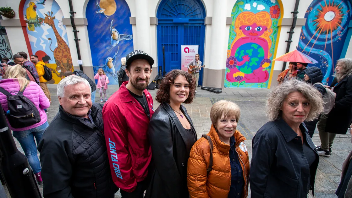 Guernsey Arts and Bailiwick Estates invited artists and members of the public to a celebration of the Arch Art Project in Market Street. Guernsey Arts head of development Russ Fossey, left, and Bailiwick Estates director Sonya Taylor, right, are pictured with three of the artists, left to right, Adam Gillson, Alisha Flouquet and Vivien Ferneyhough. (Picture by Luke Le Prevost, 32112673)