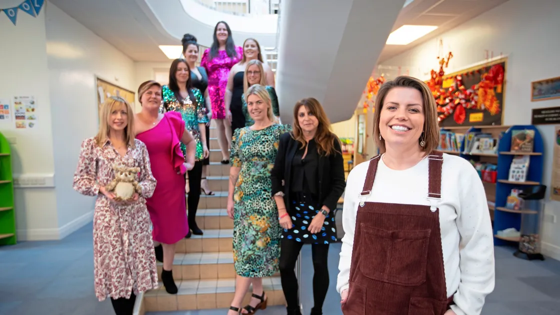 Sara Edmonds, foreground, is a staff member at Capelles School and is organising a pre-loved dresses sale to raise money for the Priaulx Premature Baby Foundation. Left to right, Sammy Meerveld (with Nighty the Owl – the mascot of the ‘Buy a Night’ campaign), Sam Niles, Kelly Baudains, Dawn Robilliard, Nicki Waterworth, Sam Vaudin, Alexia Corson, Kyra Butcher, and Priaulx Premature Baby Foundation co-founder Jo Priaulx. (Picture by Peter Frankland, 32933285)