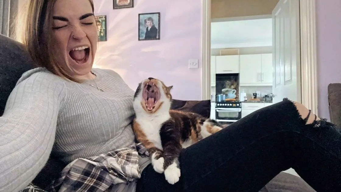 Yawning together, Lulu and her owner Rheirna Fedorenko.
