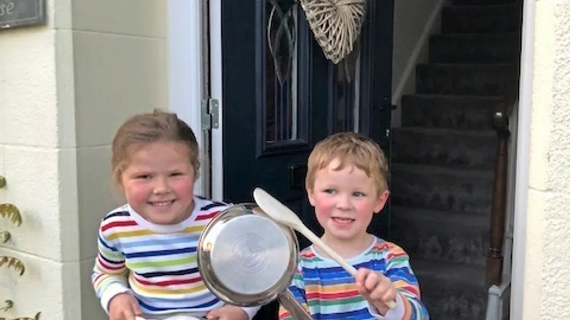 Picture supplied. 16-04-20 Georgia Tyson (age 5) and Charlie Tyson (age 3) in St. Peter Port banging their pans for all the wonderful carers. (28042921)