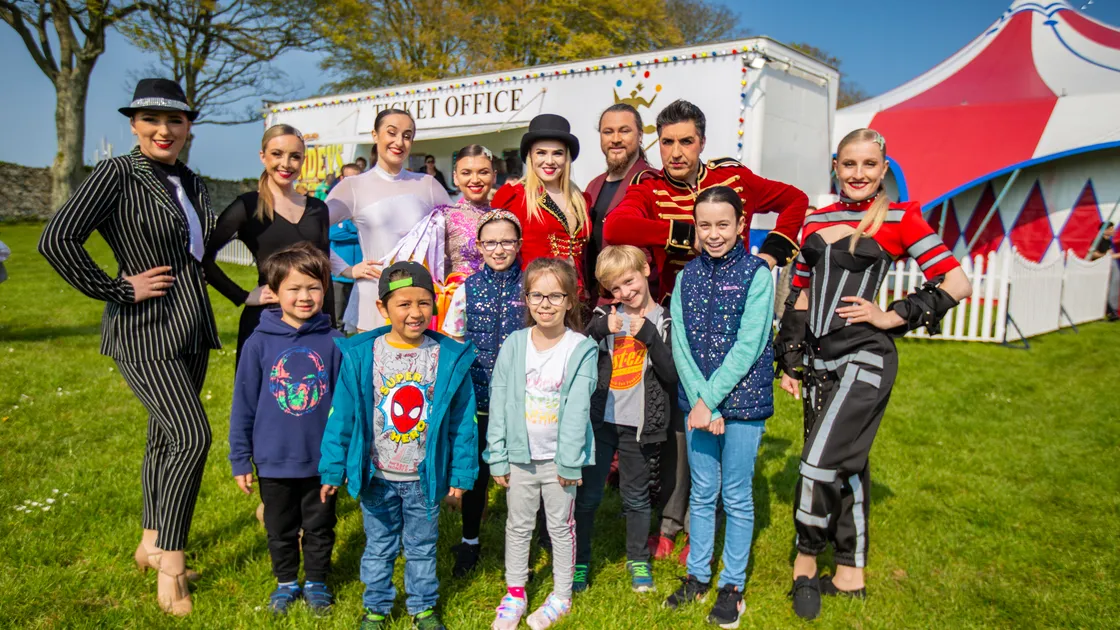 Some of the artistes from Gandey’s Circus were all smiles as they gave a personal welcome to young audience members yesterday, a sharp contrast to the day before when they shed tears of relief that the show was going on after having to move the big top to Cambridge Park. Receiving the special welcome were, left to right, Sebastian Ogier, 5, Arin Smith, 5, Lola Greenway, 9, Isla Rodrigues, 8, Carter Smith, 7, and Willow Greenway, 11. (Picture by Sophie Rabey, 32035351)
