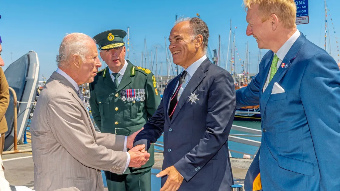 Knight Commander of St John Guernsey John Hollis, centre, being presented to King Charles III during the royal visit. (Picture by Chris George)