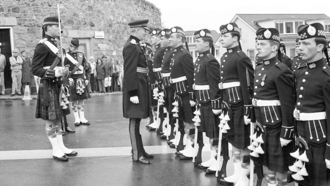 Sir Alexander Boswell inspecting a half guard of Argyll and Sutherland Highlanders, who travelled to the island for his swearing in as Lt-Governor in 1985. (30197791)