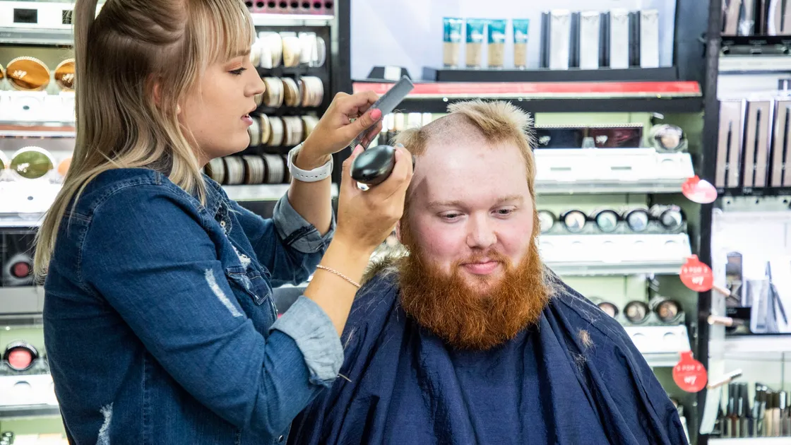 Picture by Sophie Rabey.  04-09-20.  Boots Charity Event Sponsored by All Beauty..The staff in store will be raising money for their chosen local charities buy opting to do a head/beard shave or leg/chest waxing..Courtney Le Moigne from All Beauty who is cutting Gareth Davies hair and beard to raise money for MUG.. (28653429)