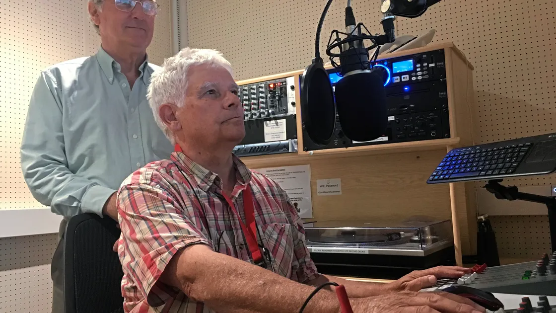 David Eaton, standing, and Barry Bridel at Jubilee Hospital Radio’s 40th anniversary show. (21831837)