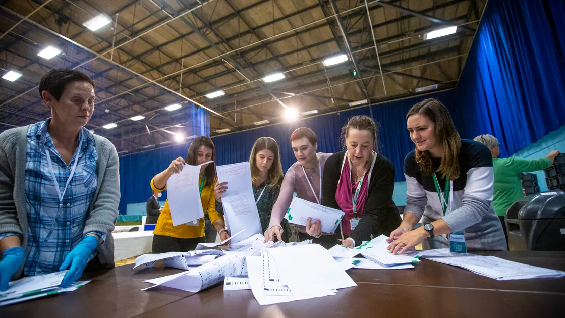 Picture by Guernsey Press 08-10-20 Guernsey general election 2020 counting the votes at Beau Sejour. Volunteers get to work opening sorting through the very first batch of votes to be opened.. (28783473)